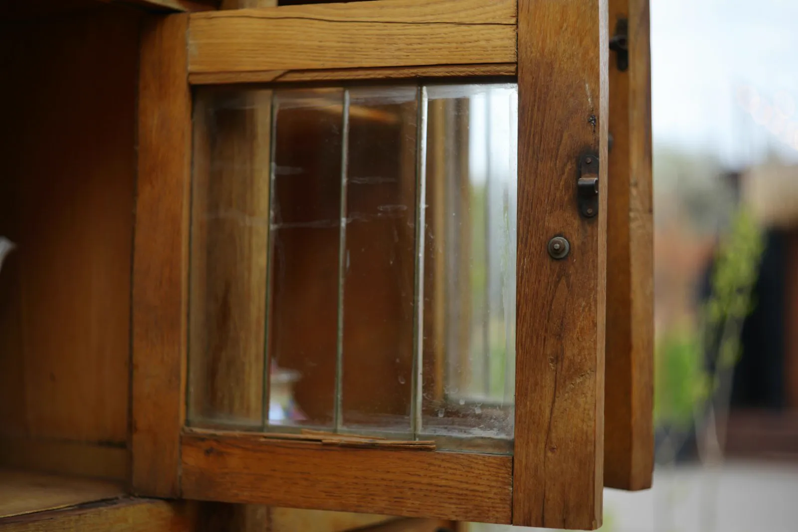 Wooden cabinet door with leaded glass panes