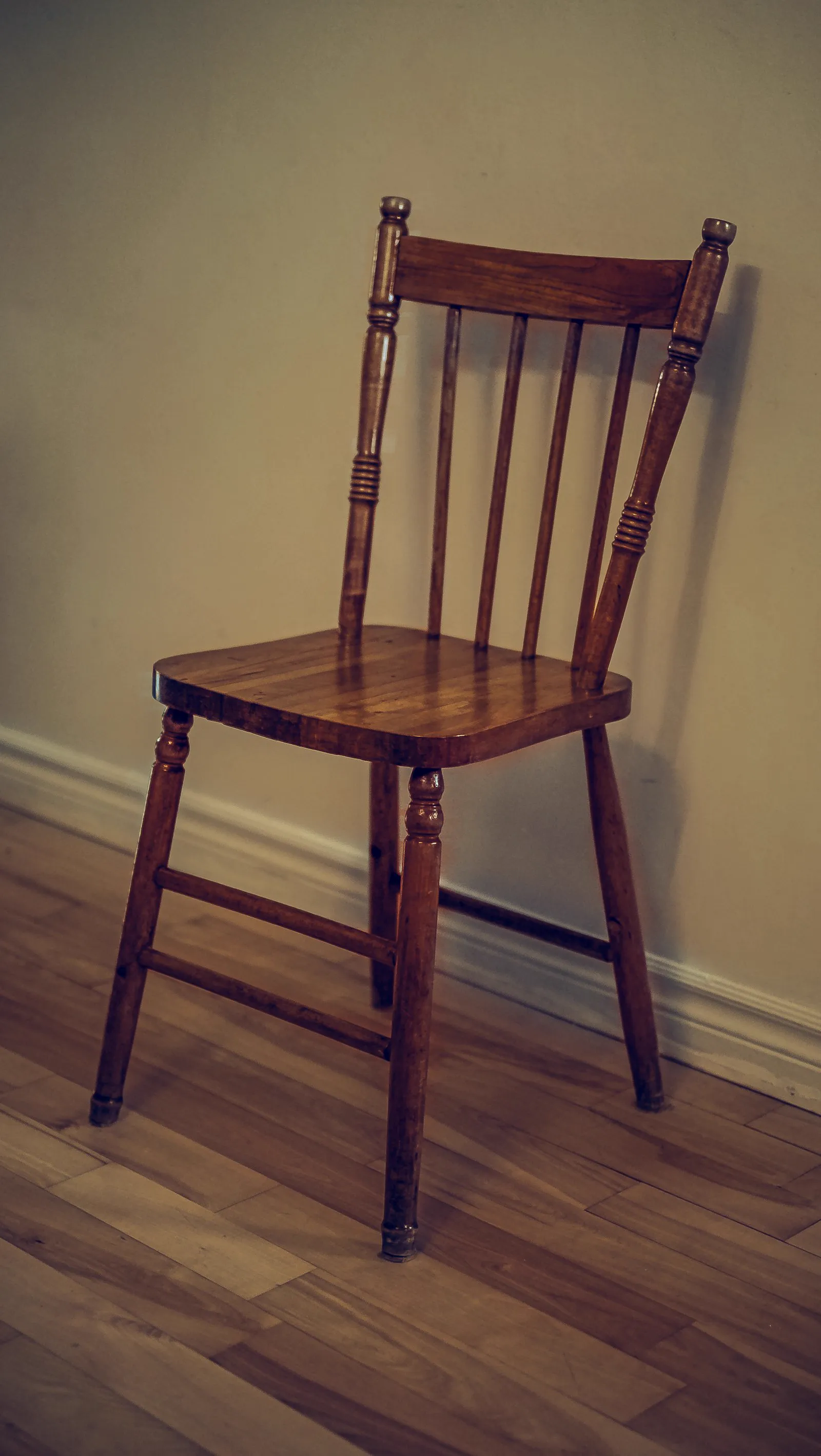 Restored wooden spindle back chair with a warm hand rubbed finish