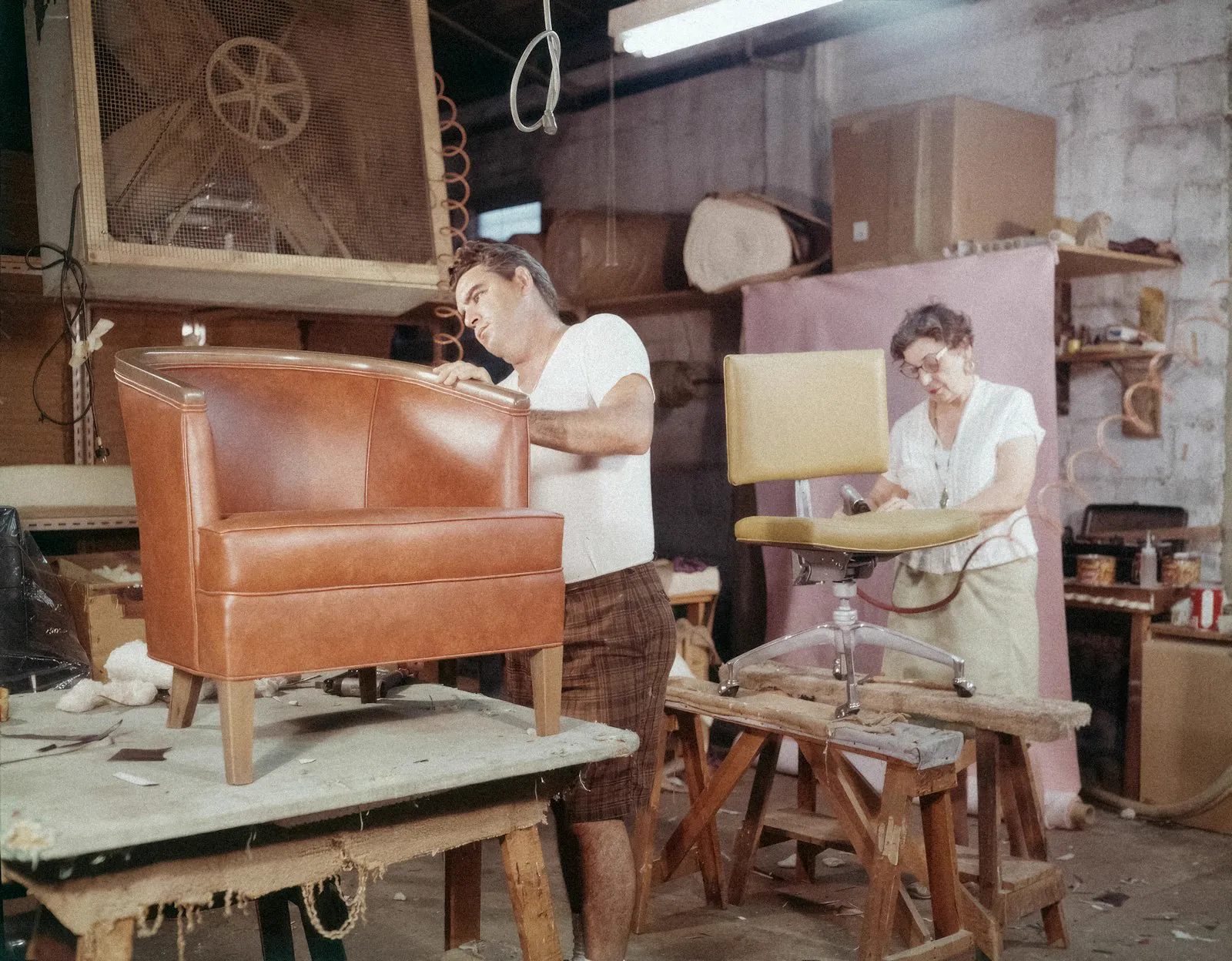 Craftspeople restoring antique furniture in the workshop